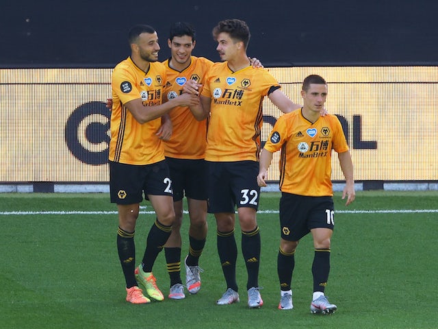 Wolverhampton Wanderers players celebrate Raul Jimenez's goal against Everton in the Premier League on July 12, 2020