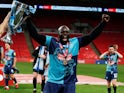 Wycombe Wanderers striker Adebayo Akinfenwa celebrates winning promotion to the Championship on July 13, 2020