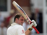 Andrew Strauss raises his bat after reaching a century in England's Test with Pakistan in July 2006.