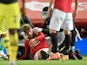 Manchester United's Brandon Williams receives treatment to a head injury in July 2020