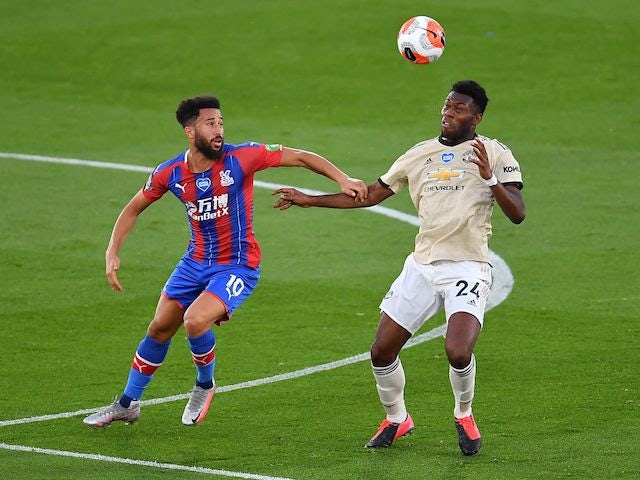 Crystal Palace's Andros Townsend in action with Manchester United's Timothy Fosu-Mensah in the Premier League on July 16, 2020