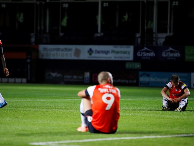 Luton players look dejected after drawing with QPR on July 14, 2020
