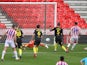 Stoke City's Lee Gregory scores against Brentford on July 18, 2020