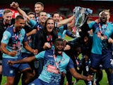 Wycombe Wanderers players celebrate winning promotion to the Championship with victory in the League One playoff final on July 13, 2020
