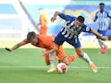 Brighton's Neal Maupay tangles with Newcastle's Matt Ritchie on July 20, 2020