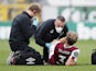 Burnley's Charlie Taylor receives treatment on July 15, 2020