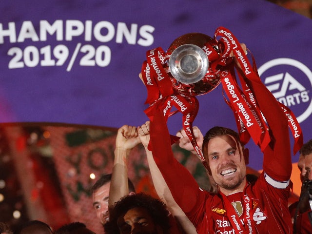 Liverpool captain Jordan Henderson lifts the Premier League trophy on July 22, 2020
