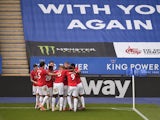 Manchester United players celebrate Bruno Fernandes's goal against Leicester City in the Premier League on July 26, 2020