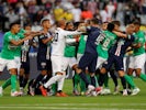 Paris Saint-Germain and Saint-Etienne players fight in the Coupe de France final on July 24, 2020