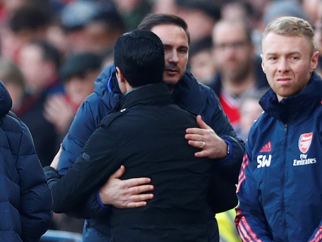 Chelsea manager Frank Lampard and Arsenal boss Mikel Arteta hug in December 2019