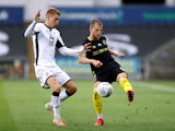 Swansea City's Jay Fulton in action with Brentford's Mathias Jensen in the Championship playoffs on July 26, 2020