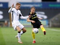 Swansea City's Jay Fulton in action with Brentford's Mathias Jensen in the Championship playoffs on July 26, 2020