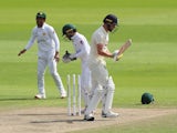 England's Chris Woakes in action with Pakistan's Yasir Shah on August 7, 2020