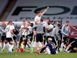 Fulham players and staff celebrate in the Championship playoff final on August 4, 2020