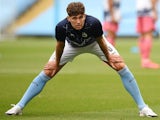 John Stones warms up for Man City on August 7, 2020