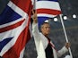 Mark Foster carries the Olympic flag for Great Britain at the Beijing Games in 2008