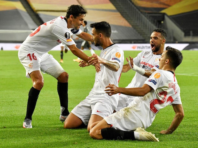 Sevilla players celebrate Suso's goal against Manchester United on August 16, 2020
