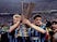 Inter Milan players Dennis Bergkamp and Wim Jonk celebrate with the UEFA Cup in 1994