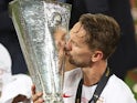 Sevilla hero Luuk de Jong kisses the Europa League trophy following their victory over Inter Milan on August 21, 2020