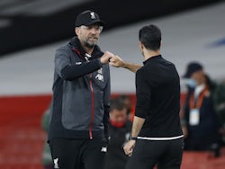 Liverpool manager Jurgen Klopp fist bumps Arsenal counterpart Mikel Arteta in July 2020