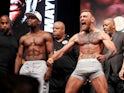 Conor McGregor and Floyd Mayweather during the weigh-in for their 2017 fight