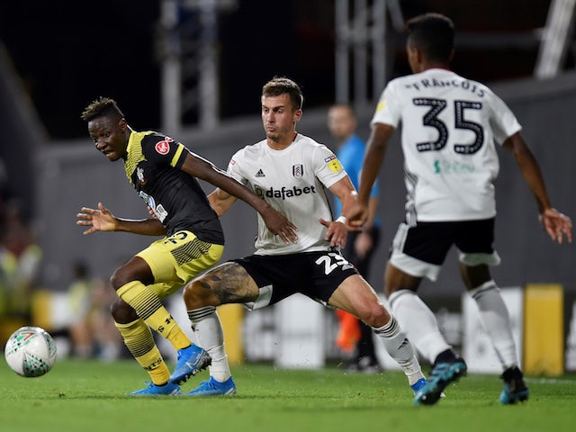 Fulham players try to tackle Moussa Djenepo in their EFL Cup clash with Southampton in August 2019