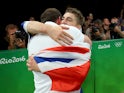 Gymnast Max Whitlock celebrates with coach Scott Hann at the Rio Olympics on August 14, 2016