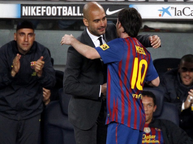 Lionel Messi celebrates with Pep Guardiola in 2012