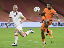 Netherlands's Memphis Depay in action with Poland's Kamil Glik in the UEFA Nations League on September 4, 2020