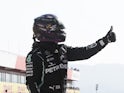 Lewis Hamilton celebrates getting pole at the Tuscan Grand Prix