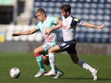 Preston's Alan Browne and Swansea's Jake Bidwell battle for the ball on September 12, 2020