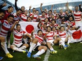 Japan players celebrate beating South Africa at the 2015 Rugby World Cup