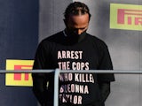 Lewis Hamilton wears a top reading "arrest the cops who killed Breonna Taylor" during the Tuscan Grand Prix in September 2020