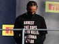 Lewis Hamilton wears a top reading "arrest the cops who killed Breonna Taylor" during the Tuscan Grand Prix in September 2020