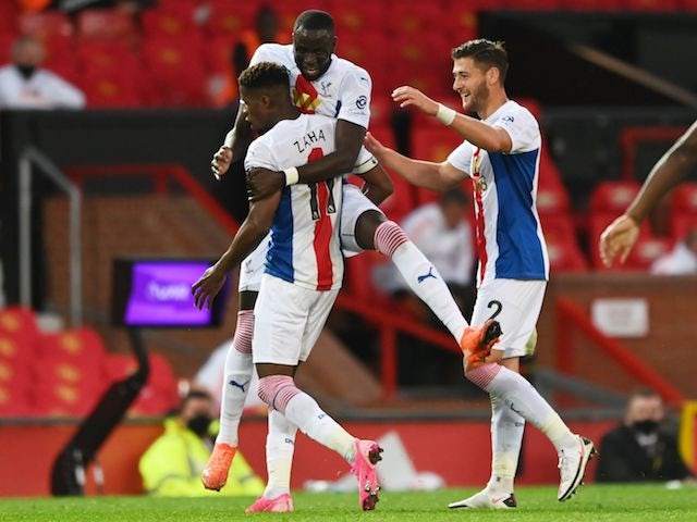 Crystal Palace winger Wilfried Zaha celebrates with teammates after scoring against Manchester United on September 19, 2020