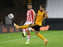 Wolverhampton Wanderers' Pedro Neto in action with Stoke City's Tommy Smith in the EFL Cup on September 17, 2020