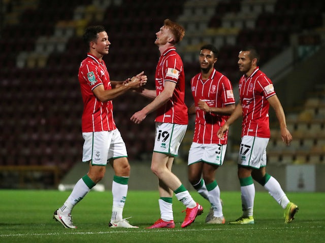 Lincoln City players celebrate scoring against Bradford in the EFL Cup in September 2020