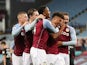 Aston Villa striker Ollie Watkins celebrates with teammates after completing his hat-trick against Liverpool on October 4, 2020