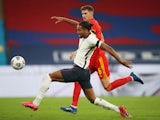 England's Dominic Calvert-Lewin in action with Wales' Chris Mepham in an international friendly on October 8, 2020