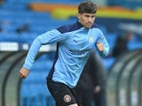 John Stones warms up for Manchester City on October 3, 2020