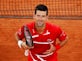 French Open day nine: Novak Djokovic survives hitting another line judge