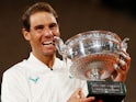 Rafael Nadal celebrates with the French Open trophy after beating Novak Djokovic on October 11, 2020