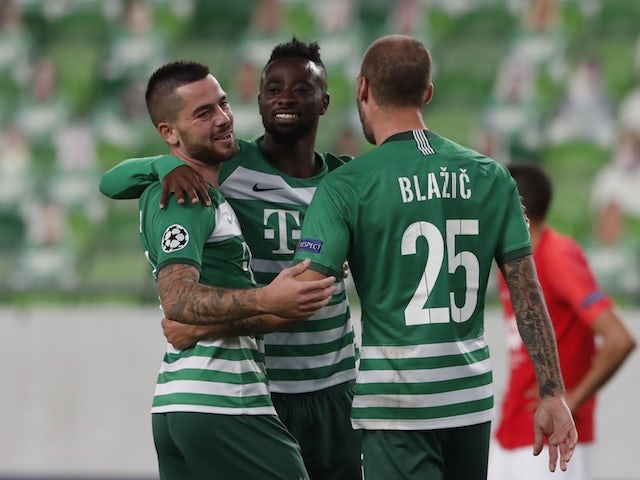 Ferencvaros' Miha Blazic celebrates with teammates against Molde in the Champions League playoffs on September 29, 2020