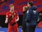 Belgium's Kevin De Bruyne talks to manager Roberto Martinez after coming off injured against England in October 2020