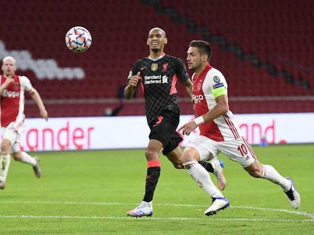 Ajax's Dusan Tadic in action with Liverpool's Fabinho in the Champions League on October 22, 2020