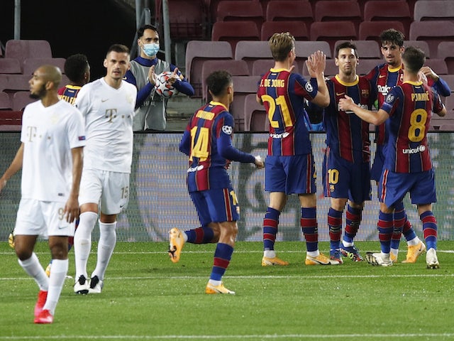 Barcelona's Lionel Messi celebrates with teammates after scoring against Ferencvaros on October 20, 2020
