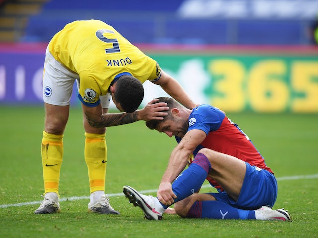 Crystal Palace defender Gary Cahill is hurt after a challenge by Brighton's Lewis Dunk in October 2020