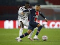Paris Saint-Germain's Kylian Mbappe in action with Manchester United's Axel Tuanzebe in the Champions League on October 20, 2020