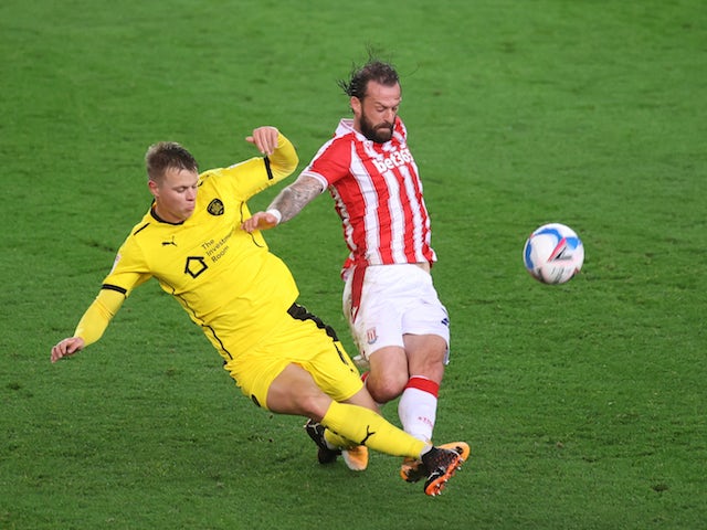 Stoke City's Steven Fletcher in action with Barnsley's Mads Andersen in the Championship on October 21, 2020