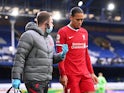 Liverpool defender Virgil van Dijk walks off injured during the Merseyside derby against Everton on October 17, 2020